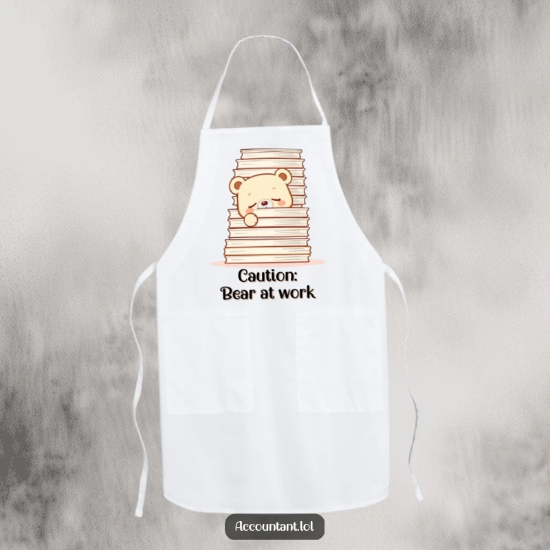 Funny Apron with a sleepy bear cub hiding behind kitchen papers, a humorous cooking accessory.