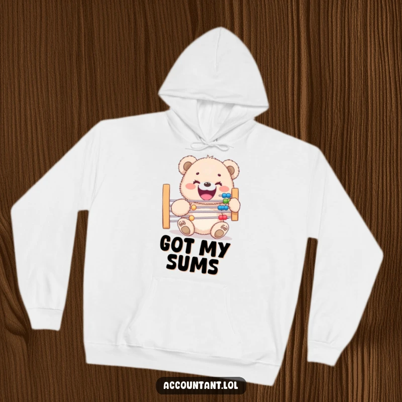 Funny hoodie depicting a smiling fluffy bear cub adorably grappling with a massive abacus, bringing computational cheer to your day.