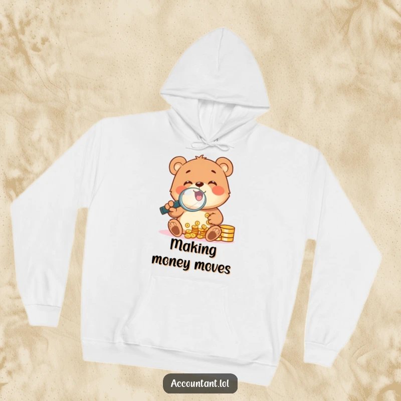 Funny cheerful bear cub using a magnifying glass to count coins, designed on a warm and funny hoodie.