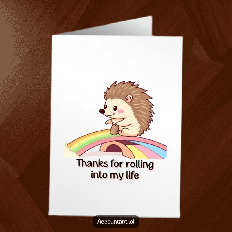 Funny Free Printable Thank You Card: Happy hedgehog rolling a ledger across a rainbow bridge, conveying gratitude with a smile.