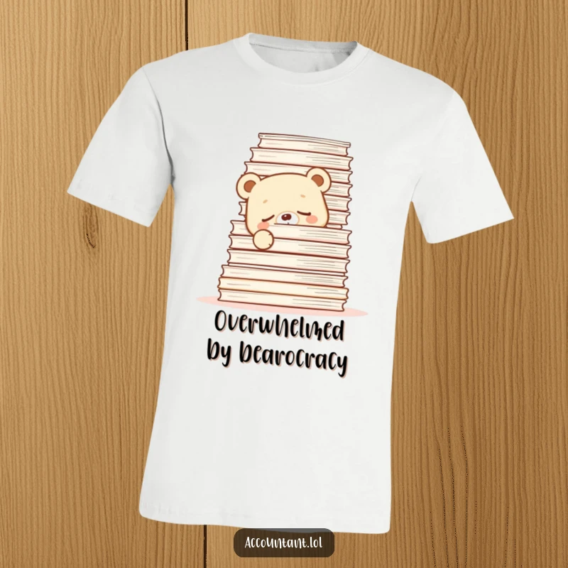 Funny T-Shirt with a sleepy bear cub hiding behind a tall stack of papers, a relatable office humor design.