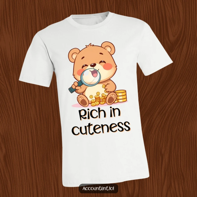 A cheerful bear cub gleefully counting shiny coins with a magnifying glass, featured on a funny t-shirt.