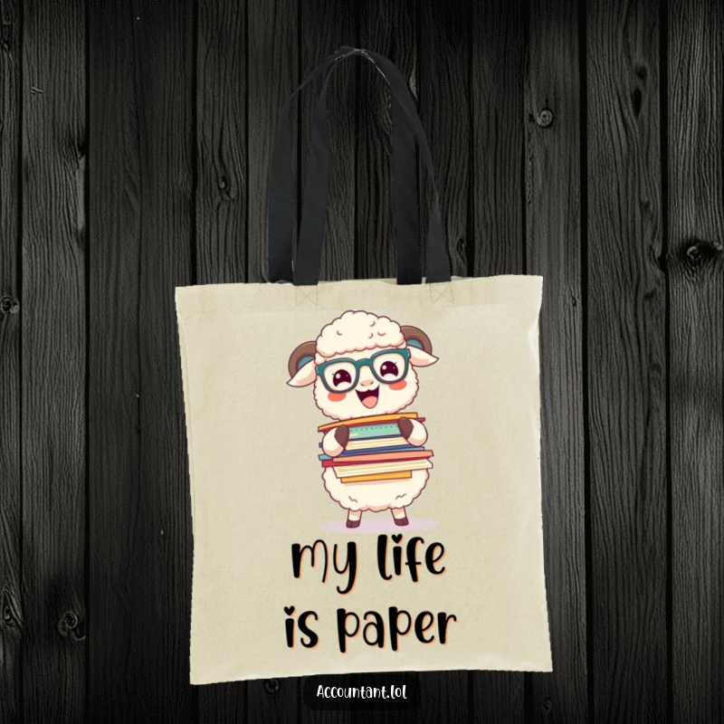 Funny sheep with glasses balancing a large stack of colorful papers, featured on a practical and funny tote bag.